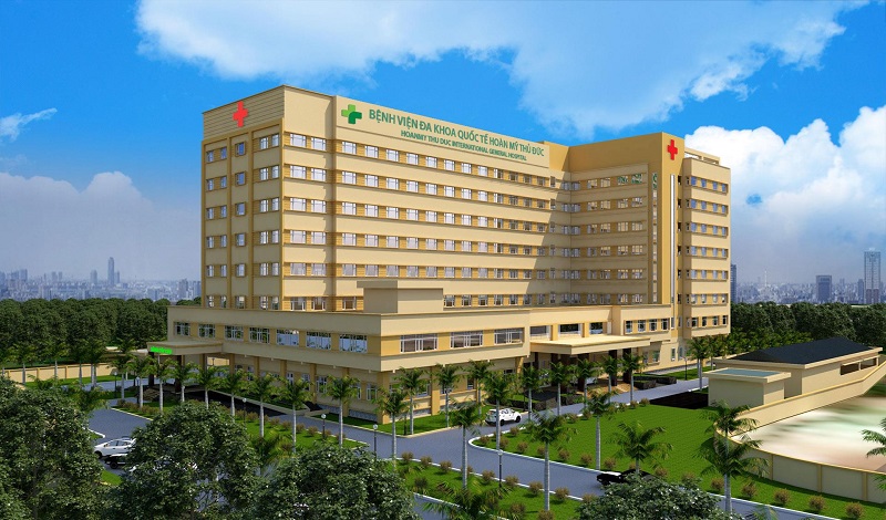 What is the procedure for investing in building a hospital in accordance with Vietnamese law?